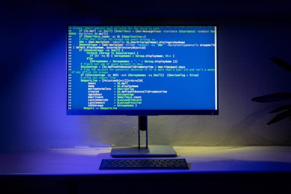A computer screen displays code on a desktop.