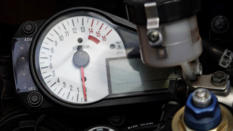 Close-up of a motorcycle's dashboard and its digital display