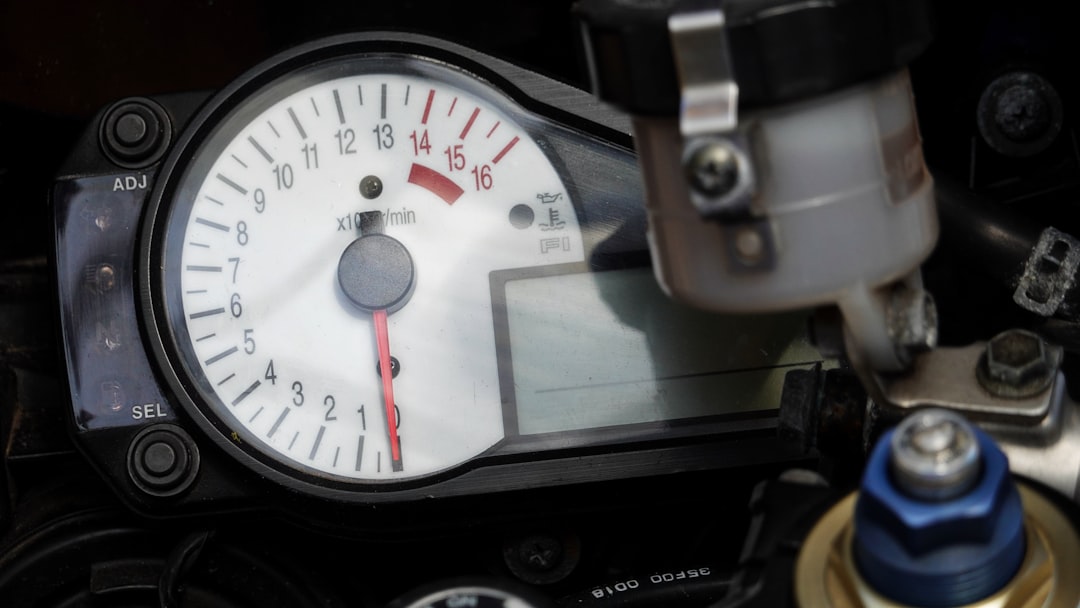 Close-up of a motorcycle's dashboard and its digital display