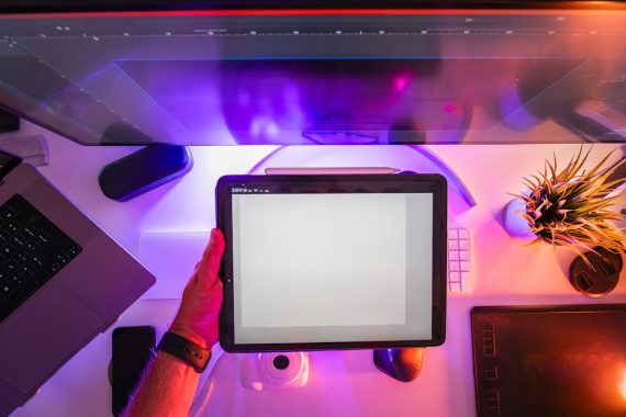 Designer holding graphic tablet home studio equipment