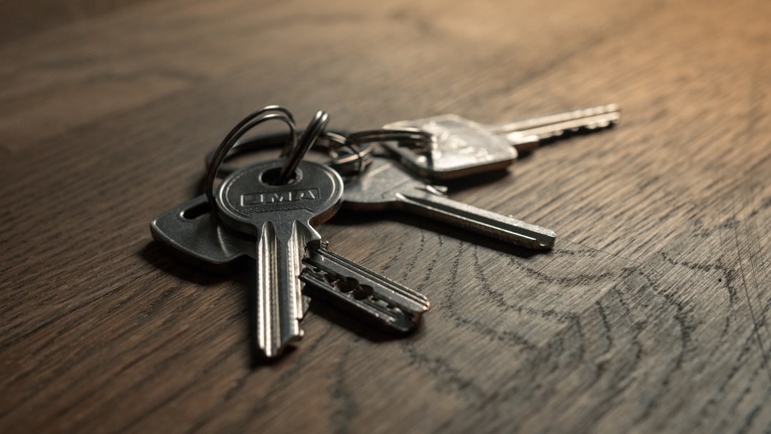 A set of keys on a wooden desk, representing ownership of and access to a business website