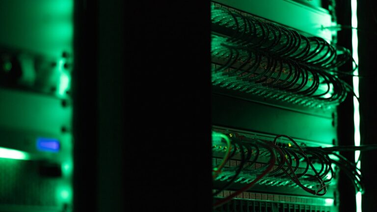 Server racks in a dark data center, the hardware behind small-business web hosting