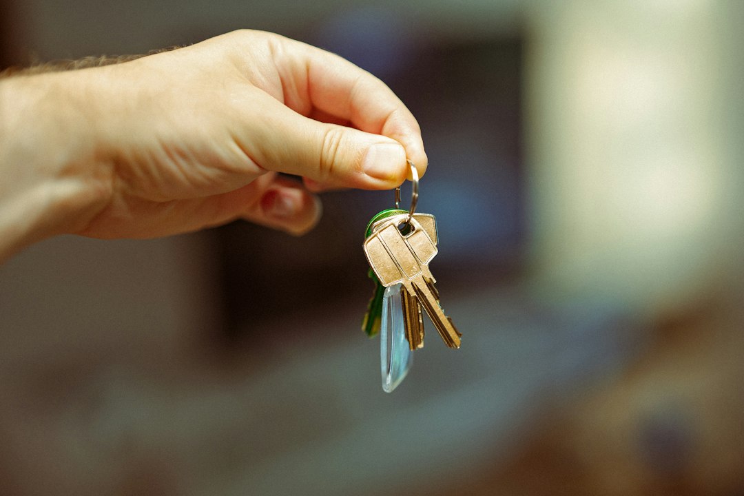 A hand holding a ring of keys, illustrating who has access to a WordPress website