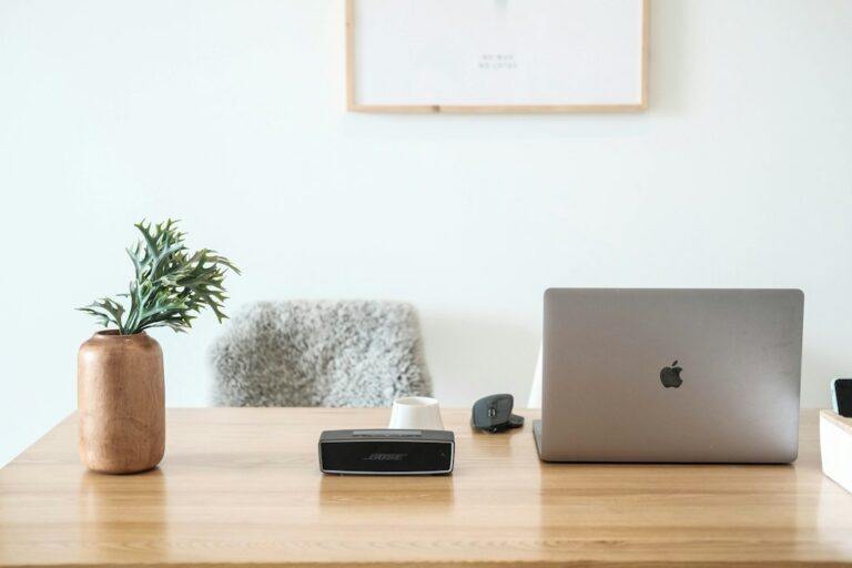 External hard drive and laptop on a desk, used for website backups