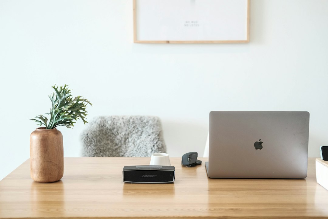 External hard drive and laptop on a desk, used for website backups