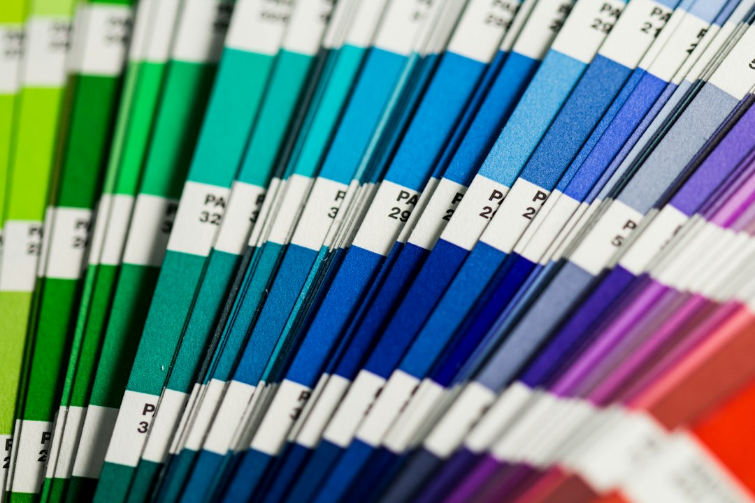 Fanned-out printed color swatch guide used to specify brand colors for press and signage